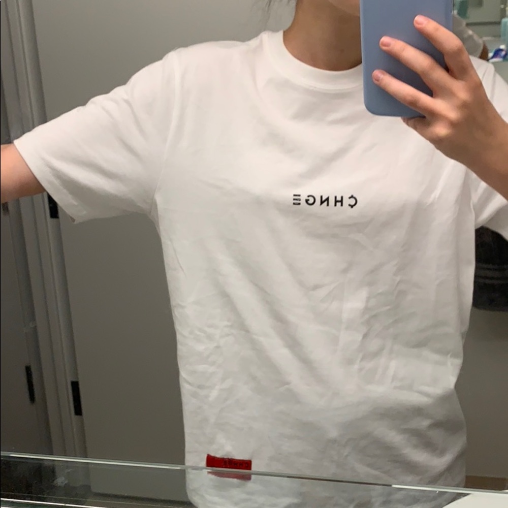 White tee from the company CHNGE.